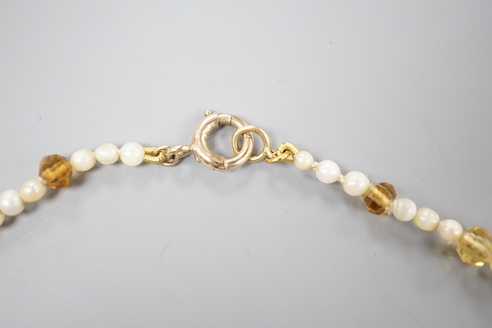 A single strand oval cut citrine and seed pearl set fringe necklace, with 9ct clasp, 44cm